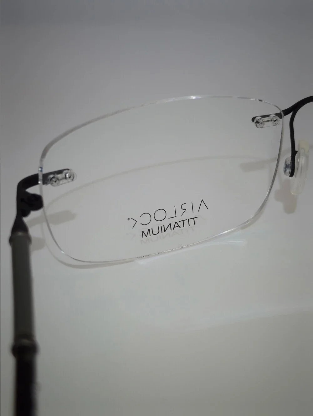 Airlock Titanium. Rimless Compression Mount. Patterns Mounting Bushing Inc.